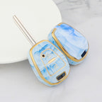 Isuzu Autoschlüsseletui, goldfarben mit Jade-Einlage